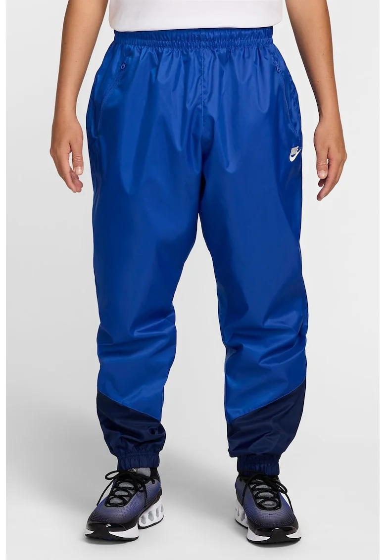 Pantaloni cu slituri cu fermoar la glezna Windrunner, Albastru royal/Bleumarin