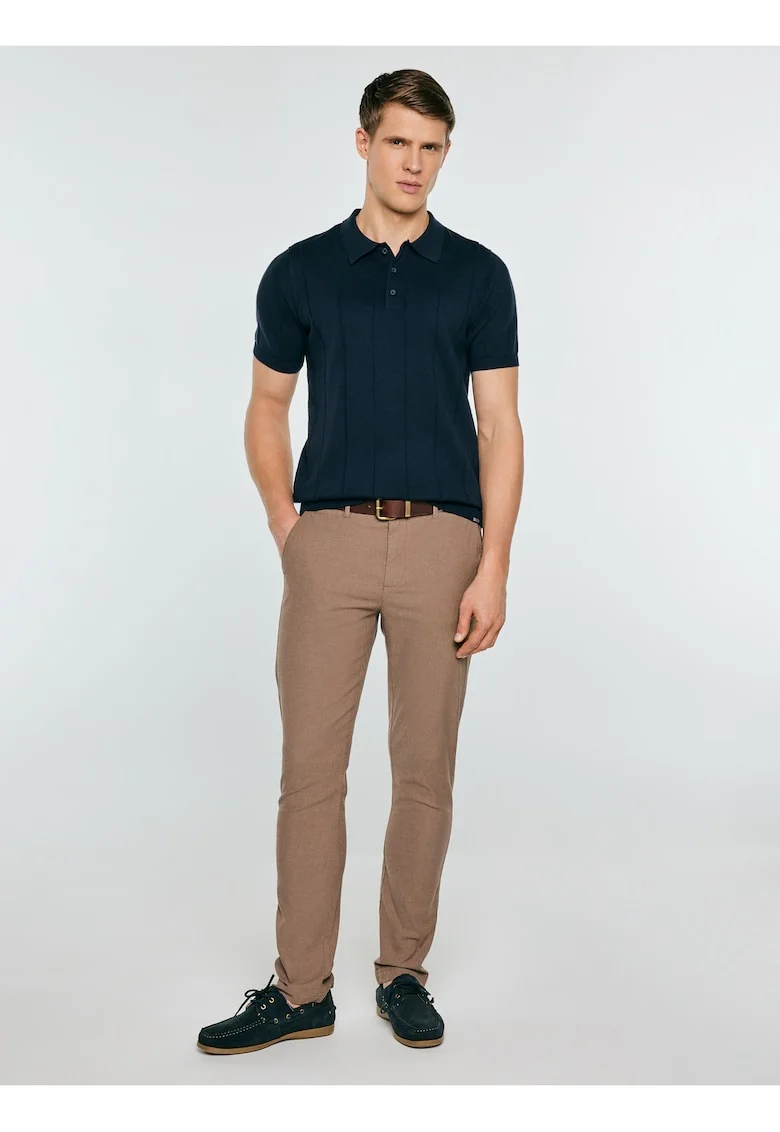 Tricou polo uni din bumbac .