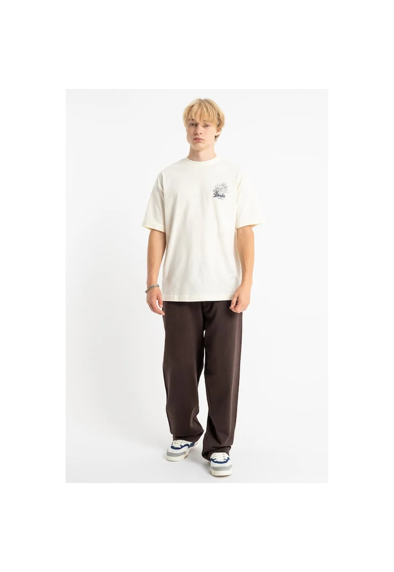 Pantaloni de trening cu croiala ampla si detaliu text
